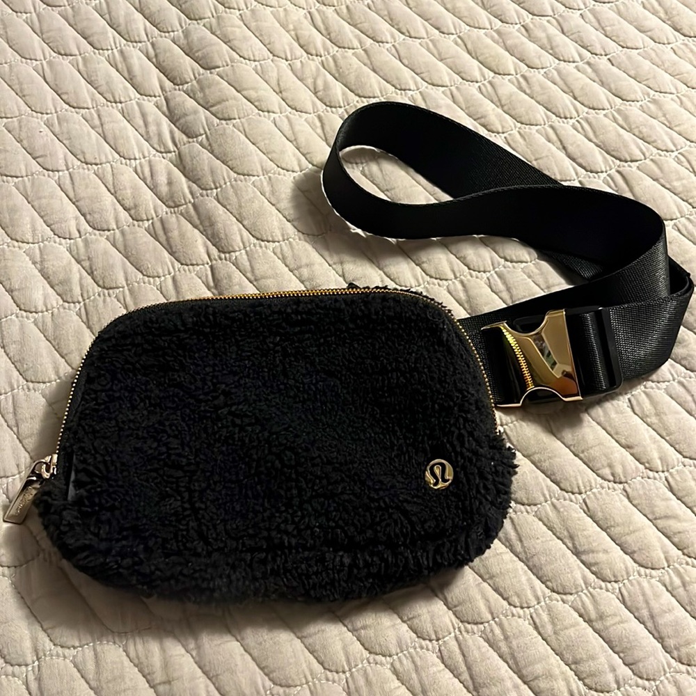 Black Lululemon fuzzy every day bag with gold hardware